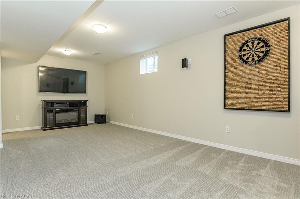 Freshly painted basement with new carpet ready for sale.